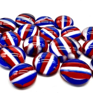 May include: A collection of 20 glass marbles with red, white, and blue stripes. The marbles are approximately 1 inch in diameter.