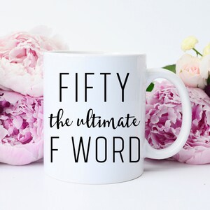 May include: White ceramic coffee mug with black text that reads "FIFTY the ultimate F WORD".