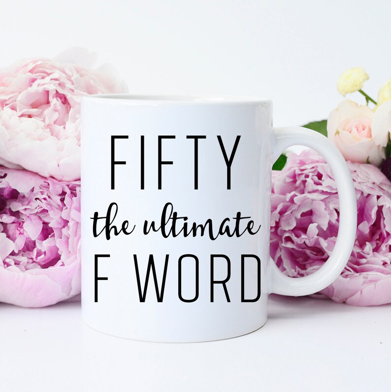 May include: White ceramic coffee mug with black text that reads "FIFTY the ultimate F WORD".