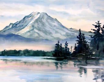 May include: A watercolor painting depicting a snow-capped mountain peak rising above a calm lake. Dark green evergreen trees line the shore in the foreground, with their reflections visible in the water. The sky features soft pastel hues of pink and blue.