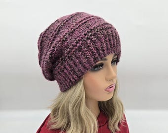 May include: A purple and black slouchy beanie hat with a textured knit pattern.