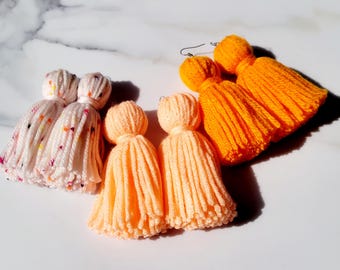 3 Piece Short Spotted White, Orange and Peach Tassel Yarn Earrings