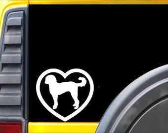 May include: White silhouette of a dog inside a heart shape, displayed on a black background. The dog is a poodle mix, with a curly tail. The sticker is likely for a car window.