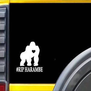 May include: A white silhouette of a gorilla with a heart in its chest on a black background with the text #RIP HARAMBE.