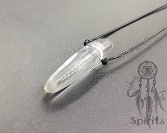 May include: A clear quartz crystal pendant on a black cord necklace. The crystal is shaped like a long, thin bullet.