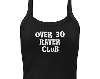 May include: Black crop top with wide straps. The white text on the front reads "OVER 30 RAVER CLUB". The top is made of a soft, likely stretchy material, and is designed to be form-fitting.