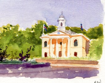 Puede incluir: Pintura a la acuarela de un edificio con columnas y una estatua. El edificio es de color naranja claro con columnas blancas y un campanario blanco. A la izquierda hay una estatua de una persona a caballo. Los árboles verdes y el cielo púrpura completan la escena.