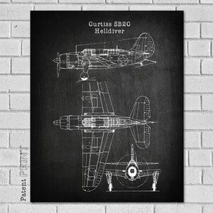 May include: Black and white line drawing of a Curtiss SB2C Helldiver aircraft. The drawing shows the aircraft from three different angles. The text "Curtiss SB2C Helldiver" is at the top of the drawing.