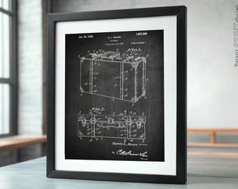 May include: A vintage black and white patent drawing of a suitcase design. The patent number is 1,667,269 and the date is January 24, 1928. The patent is for a suitcase with a hinged lid and a handle. The drawing shows the suitcase in two views, one from the top and one from the side. The patent is titled "Suitcase" and the inventor is "Harvie L. Moore".