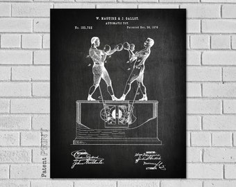 May include: Black and white patent drawing of a mechanical boxing toy. The drawing shows two figures, each with a boxing glove, punching each other. The toy is mounted on a base with a crank and gears. The patent number is 185,768 and the date is December 16, 1876.