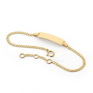 May include: A gold chain bracelet with a blank rectangular tag. The bracelet has a lobster clasp and an extension chain.