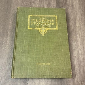 May include: A green book with the title "The Pilgrim's Progress" by John Bunyan. The book is illustrated and has a gold design on the cover.