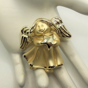 Vintage Polished and Matte Satin Gold Tone Detailed Christmas Angel Holding Star Figural Holiday Pin Brooch