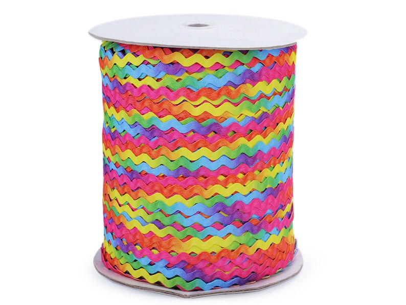 May include: A spool of rainbow colored wavy trim. The trim is made of a soft, flexible material and is perfect for adding a touch of color and whimsy to any project.