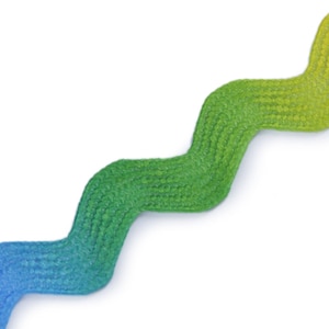 May include: A wavy, ombre ribbon with a blue to green gradient. The ribbon is made of a textured fabric.