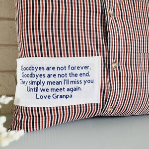 May include: A red and black striped pillow with a white patch that reads "Goodbyes are not forever. Goodbyes are not the end. They simply mean I'll miss you Until we meet again. Love Granpa"