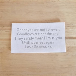 May include: White card with a message that reads: "Goodbyes are not forever. Goodbyes are not the end. They simply mean I'll miss you Until we meet again. Love Seamus xx"