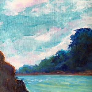 May include: An oil painting depicts a serene coastal scene. The sky is a blend of light blue, white, and pink hues, suggesting a sunrise or sunset. Lush green trees line the horizon, and the water is a vibrant turquoise. A rocky shoreline is in the foreground.