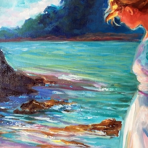 May include: An oil painting depicts a serene coastal scene. The artwork features a figure in a white dress, gazing at the turquoise water and rocky shoreline. The sky is a mix of blues and white, with dark blue foliage in the background. The painting uses a palette of blues, greens, and oranges.