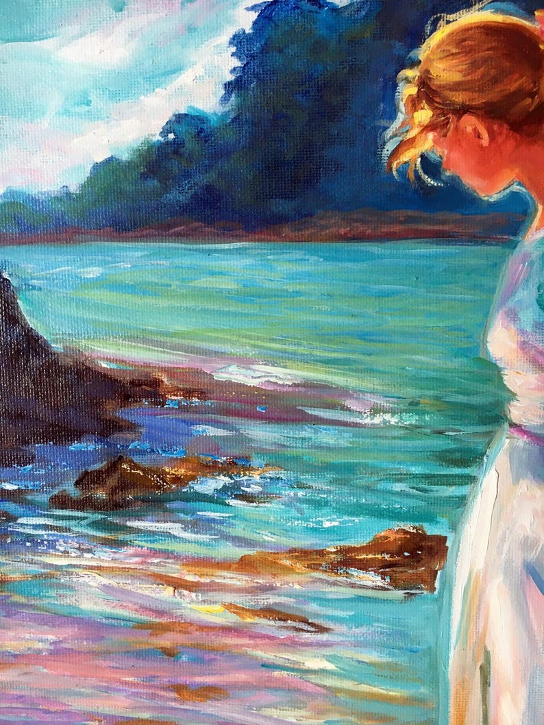 May include: An oil painting depicts a serene coastal scene. The artwork features a figure in a white dress, gazing at the turquoise water and rocky shoreline. The sky is a mix of blues and white, with dark blue foliage in the background. The painting uses a palette of blues, greens, and oranges.