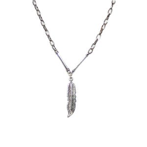 May include: A silver chain necklace with a silver feather pendant.