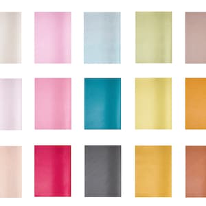 May include: A collection of 18 different colored leather swatches. The swatches are arranged in three rows of six. The colors include white, pink, light blue, light green, beige, light purple, light pink, teal, yellow, orange, peach, red, gray, gold, brown, and black.