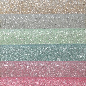 May include: Six strips of glitter fabric in various colors, including lavender, beige, silver, light green, teal, and pink. The fabric is textured with glitter and has a subtle sheen. The word "fleuriste" is printed in white at the bottom of the image.