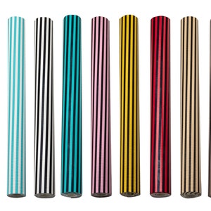 May include: Nine rolls of striped wrapping paper in various colours, including pink, blue, black, turquoise, yellow, red, beige, and brown.