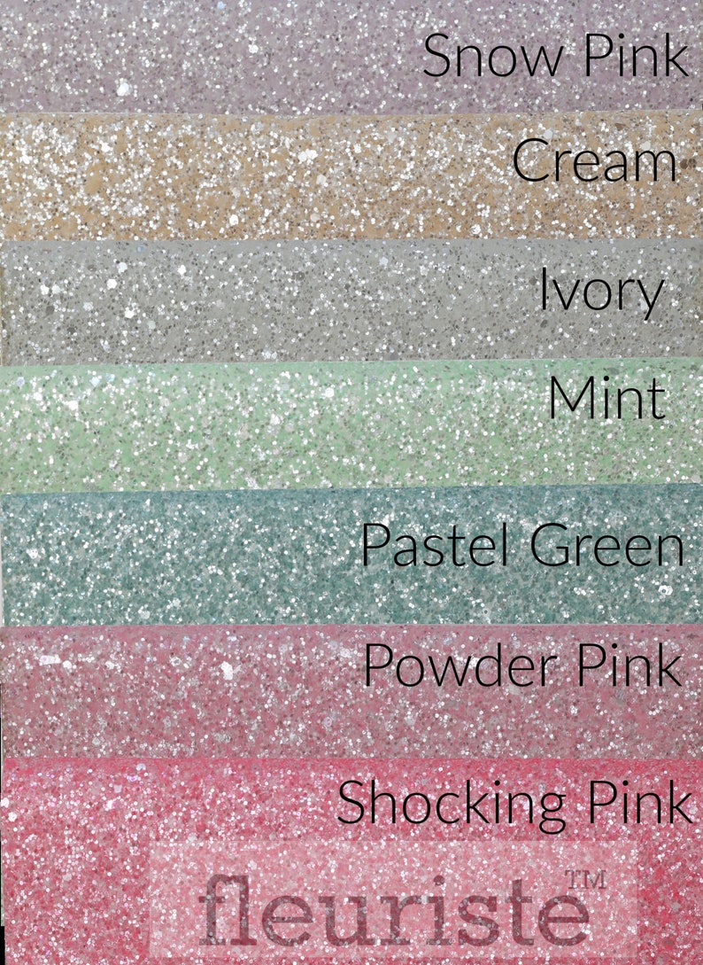 May include: Seven swatches of glitter fabric in various pastel colors, including snow pink, cream, ivory, mint, pastel green, powder pink, and shocking pink. The fabric is labeled "fleurist&eacute;&trade;".