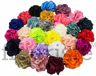 May include: Assortment of 24 colorful fabric flower hair clips. The clips are made of satin fabric and have a ruffled design. The colors include red, pink, blue, green, yellow, orange, purple, and white.