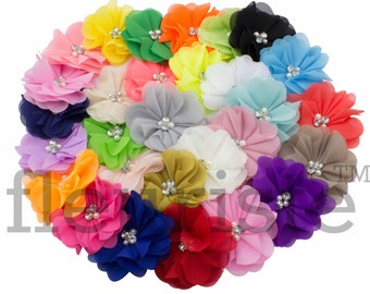 May include: Assortment of 20 colorful chiffon flower hair clips with a rhinestone center. Each flower is approximately 2 inches in diameter.
