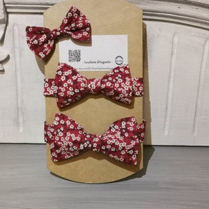 ceremonial box of 3 bow ties, including 2 children's bows and one adult bow, as well as 2 girls' barrettes. image 4