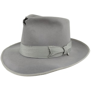 May include: A gray fedora hat with a gray ribbon and a small hole in the crown.