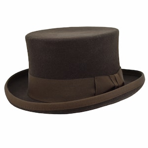 May include: A brown felt top hat with a brown grosgrain ribbon and bow.