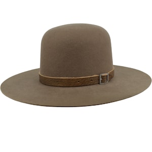 May include: A brown felt fedora hat with a wide brim and a brown leather strap with a silver buckle.