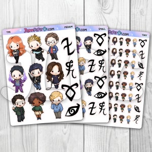 May include: A set of 3 sheets of stickers featuring characters and symbols from the popular book series, The Mortal Instruments. The stickers are in three sizes: tiny, small, and medium. The characters are illustrated in a cartoon style and include Jace, Clary, Simon, and Magnus. The symbols include the rune for strength, the rune for protection, and the rune for healing.