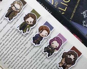May include: Set of six illustrated bookmarks featuring characters from the popular fantasy series "A Court of Thorns and Roses". Each bookmark features a different character in a chibi style with a quote from the book.