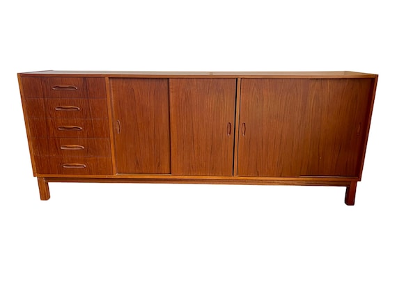 Mid Century Danish Teak credenza with (4) sliding doors and (5) drawers