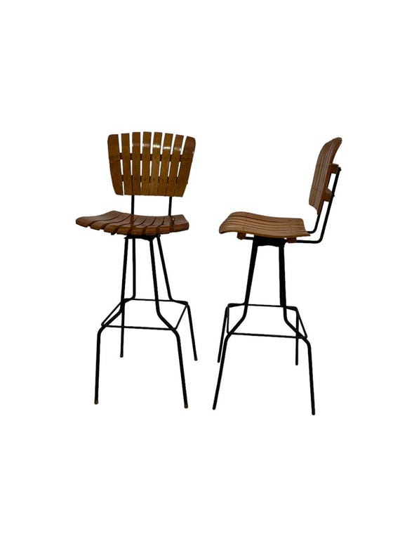 Pair of mid-century / 1970s Arthur Umanoff teak bar stools