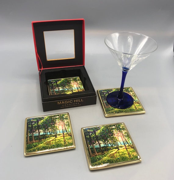 Handmade ceramic coasters with brass trim and velvet on the bottom. art by Kevin Conklin Exclusivity sold by Magic Hill Hudson.  4" inches