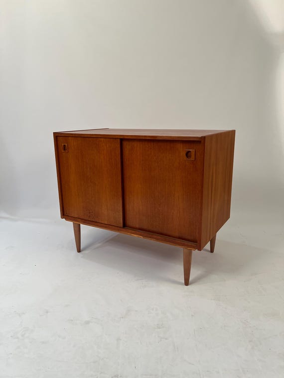 Mid-Century Teak sideboard with sliding doors.