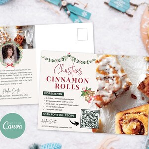 May include: A Christmas-themed postcard with a recipe for cinnamon rolls. The postcard features a photo of cinnamon rolls with white frosting and a QR code to scan for the full recipe. The text on the postcard reads "Christmas Cinnamon Rolls" and includes a list of ingredients.