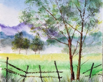 May include: A watercolor painting of a rural landscape with a wooden fence in the foreground, green grass, and trees in the background. The sky is blue with white clouds.