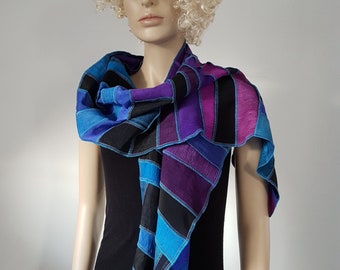 Silk scarf with strips of even smaller pieces, some linen strips, blue, black, purple, green, fuchsia, hand dyed and handmade in Holland