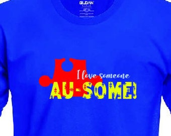 May include: A royal blue t-shirt with a red puzzle piece and the text "I love someone AU-SOME!" in yellow.