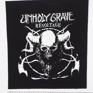 May include: Black and white embroidered patch with a skull with horns and the text "Unholy Grave Revoltage".