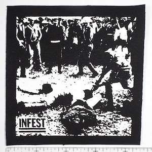 May include: Black and white patch with a graphic of a crowd of people standing over a person lying on the ground. The text "INFEST" is printed in white at the bottom of the patch.