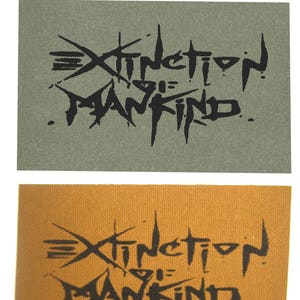 May include: Two fabric patches with the text "Extinction of Mankind" in black lettering on a green and a brown background.