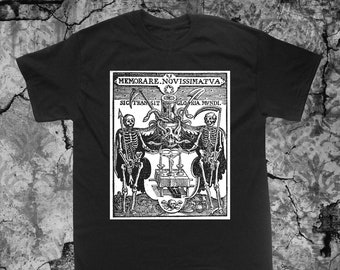 May include: Black t-shirt with a white print of a vintage woodcut illustration. The illustration depicts two skeletons holding scythes and a skull with snakes. The text in the image reads "MEMORARE. NOVISSIMATVA. SIC TRANSIT GLORIA MVNDI."