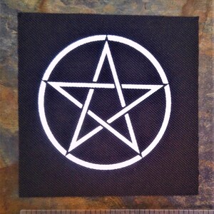 May include: White pentagram with a circle around it on a black fabric patch.